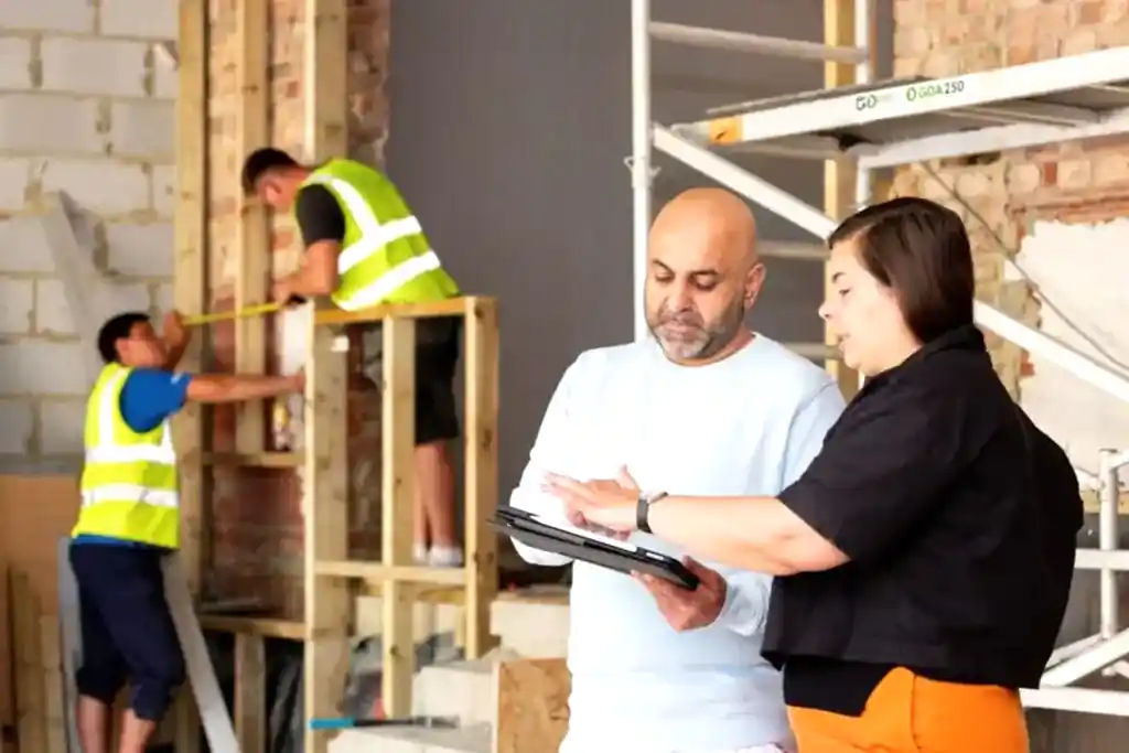 Site meeting during construction at Herbert Paradise rear and dormer extension project in Kensal Rise, NW London designed by architects RISE Design Studio