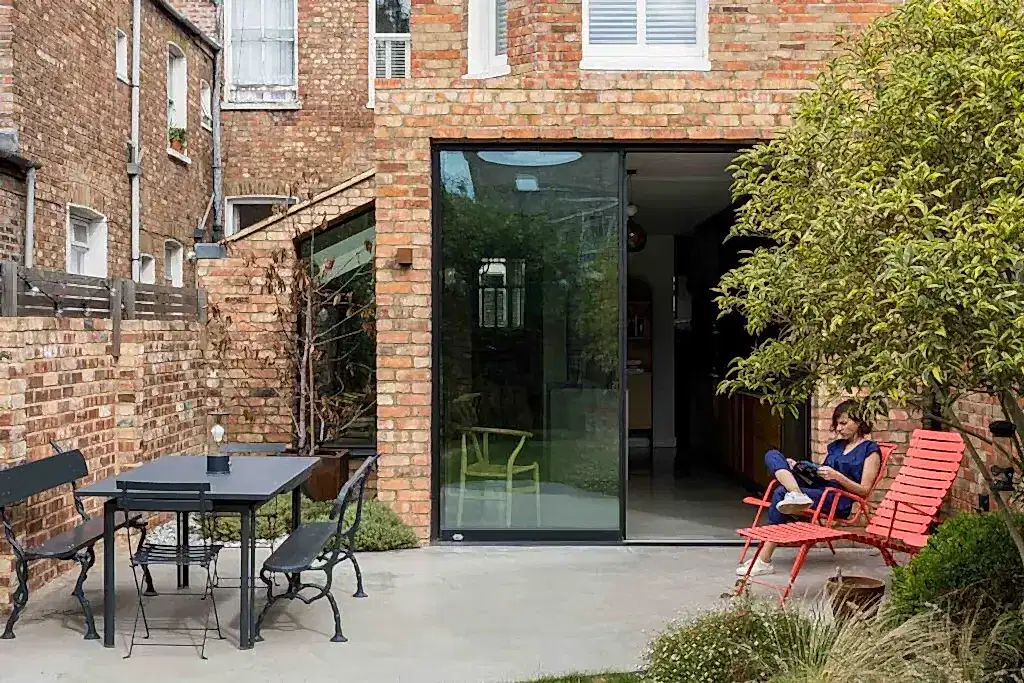 Photo of rear and side extension of Queen's Park House in NW London by RISE Design Studio