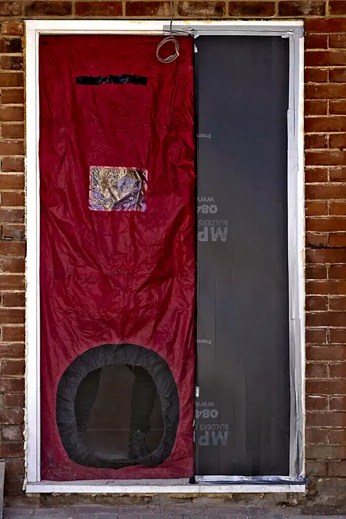 image of Blower Door Test being set up at our Red Brick House in Willesden, North West London to test airtightness