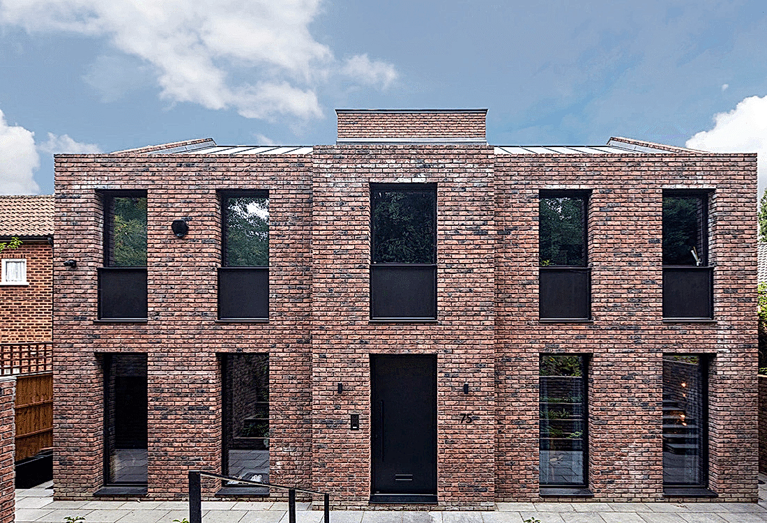 A contemporary brick building with symmetrical design that blends traditional brickwork with modern architectural lines, showcasing the fusion of legacy materials and classic aesthetics with innovative techniques and sustainable architecture.