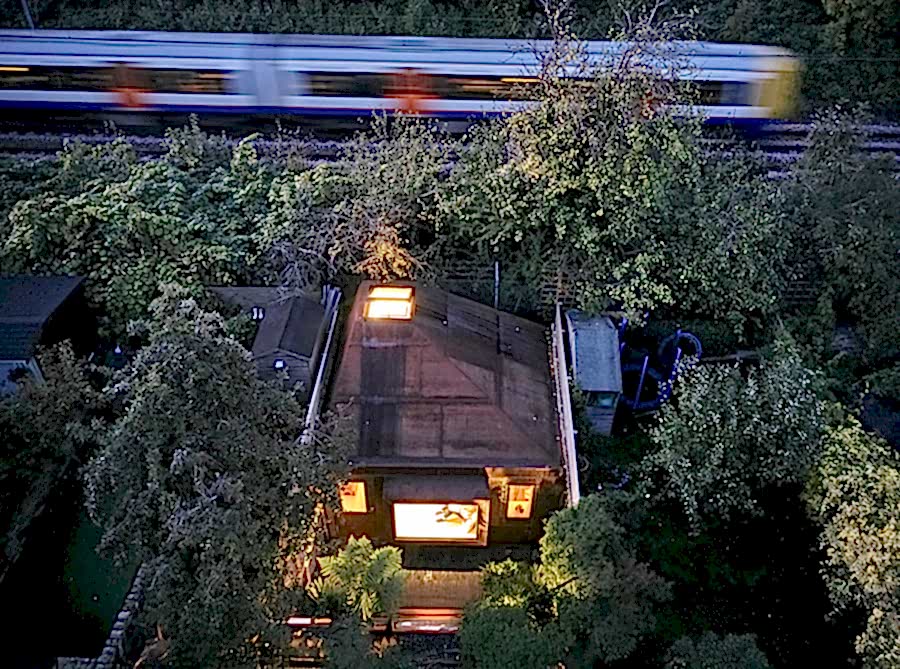 A modern garden office studio designed by RISE Design Studio, built with sustainable timber, natural light and a green roof, sitting quietly in a London back garden — showing how a permitted outbuilding can add purposeful, low-impact space to your home.